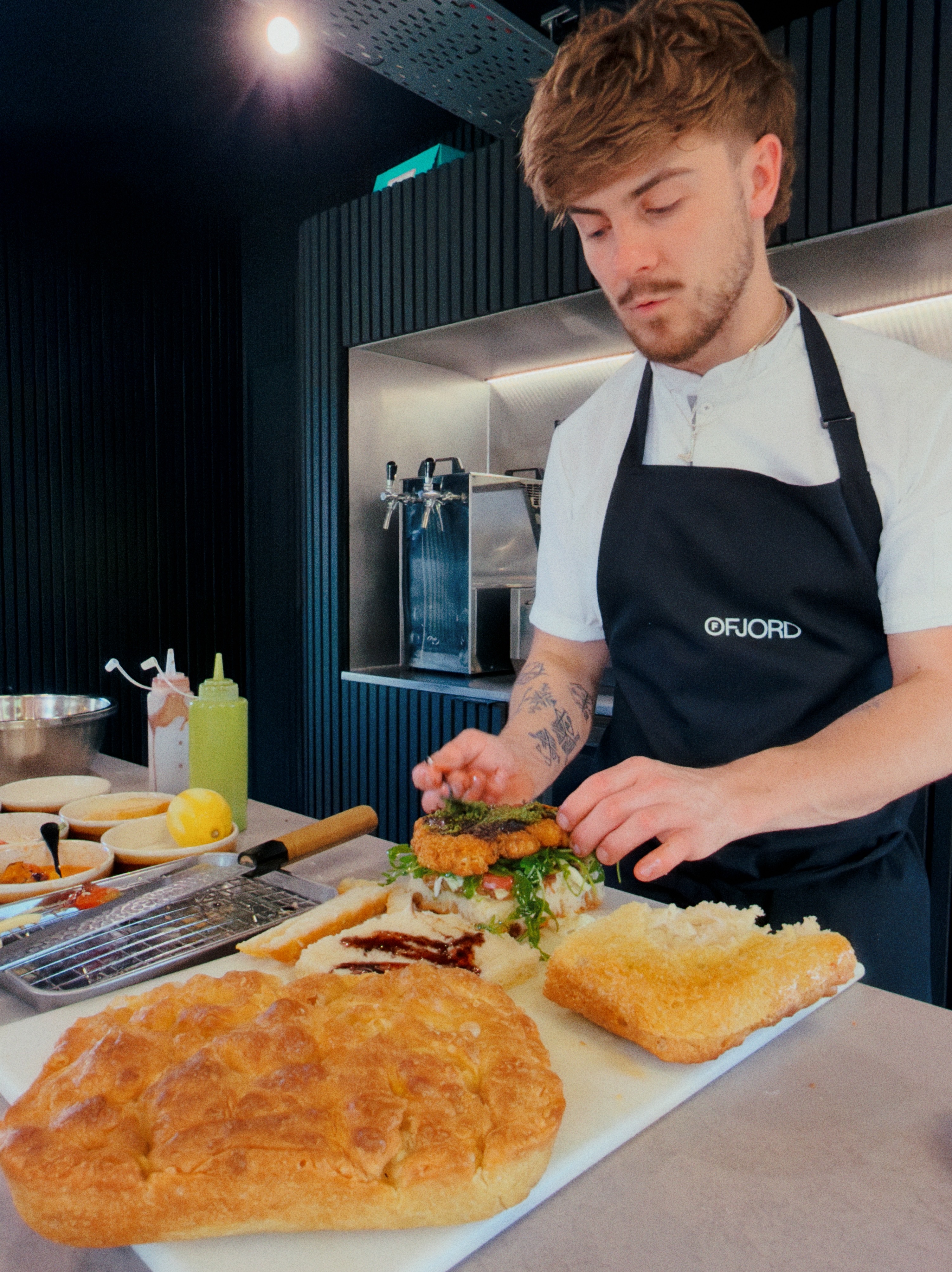 A freshly baked slab of Ruger Fjord focaccia, golden and dimpled, fresh from the oven.